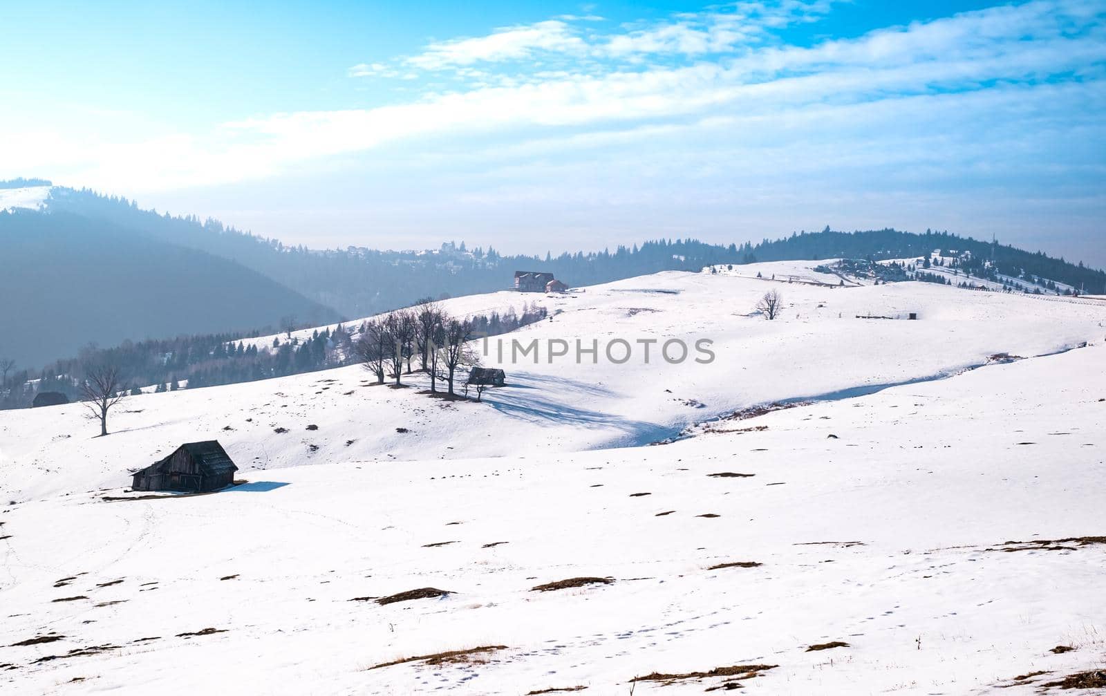 sun over the winter mountains with snow, Cindrel mountains, Paltinis, Romania
