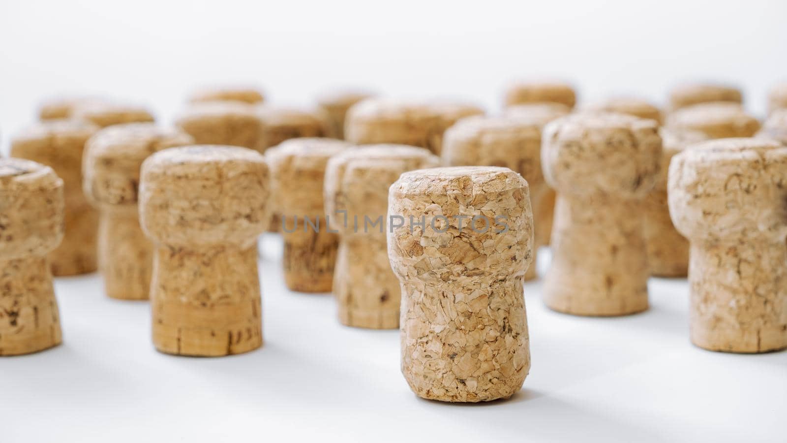 Used corks plugs from different champagne  producing on white background