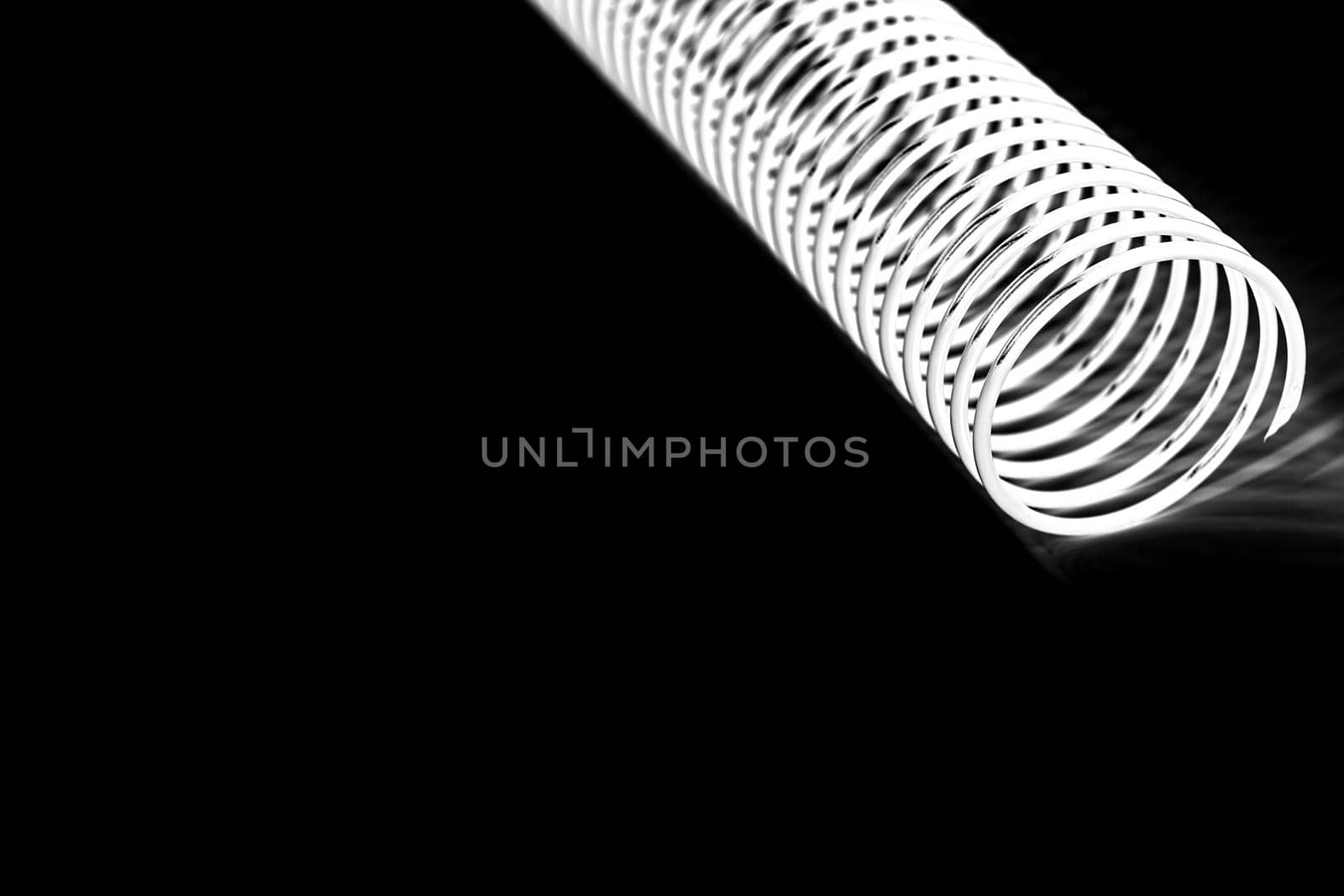 white coil spring on black