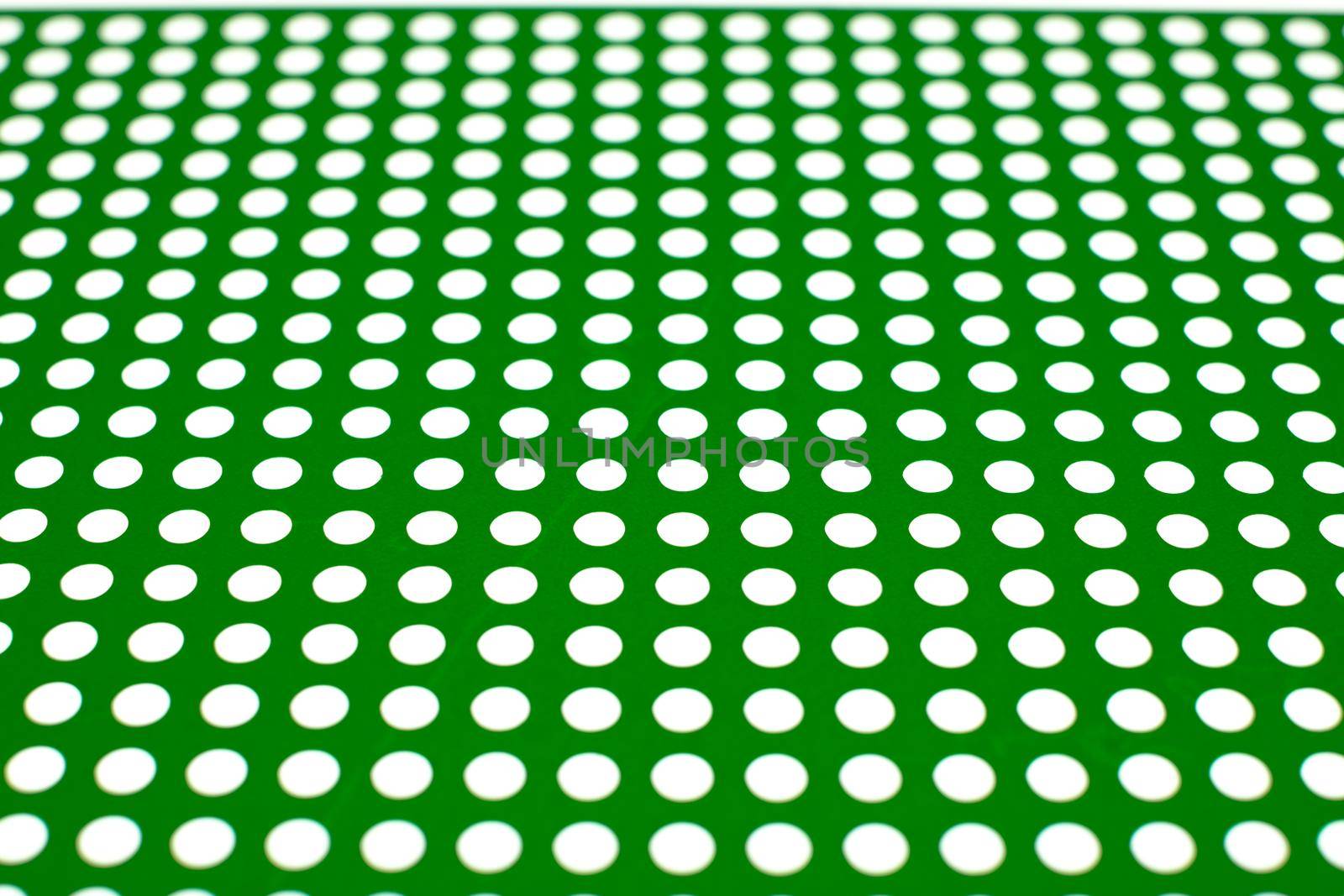 white dots on a green background