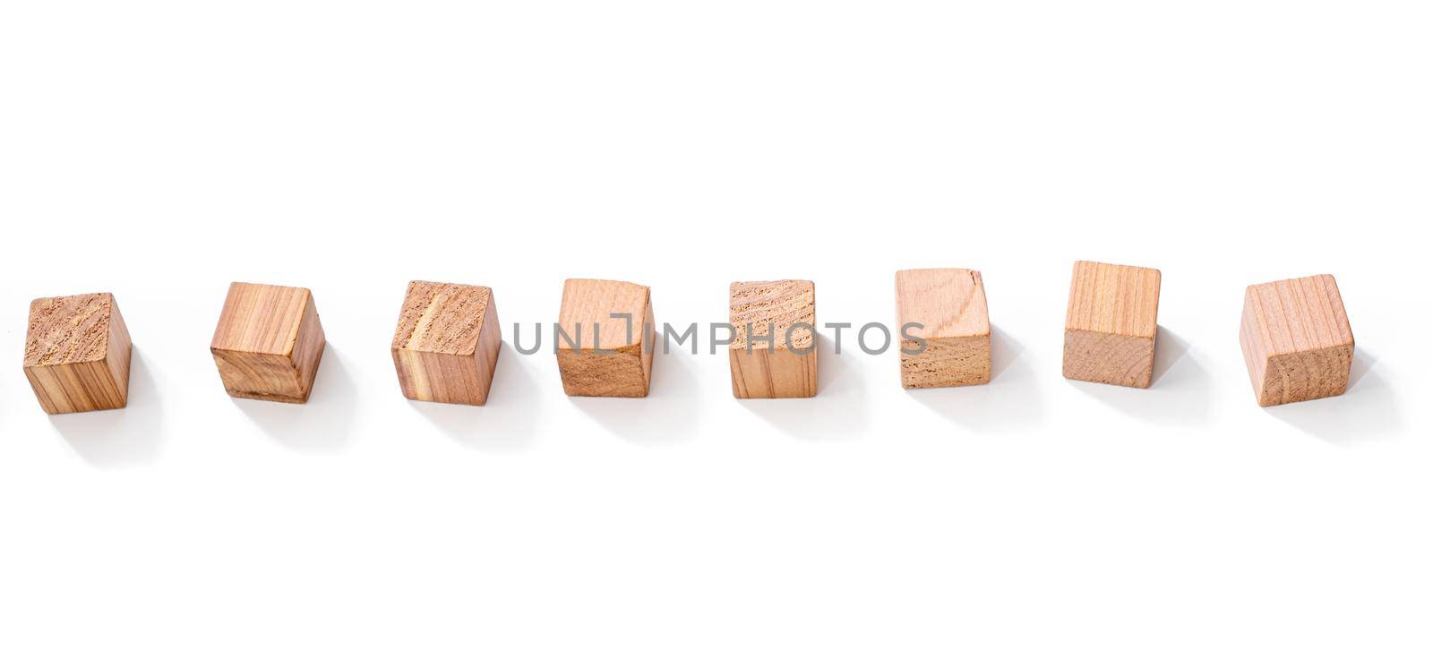 Wooden cubes in row isolated on white