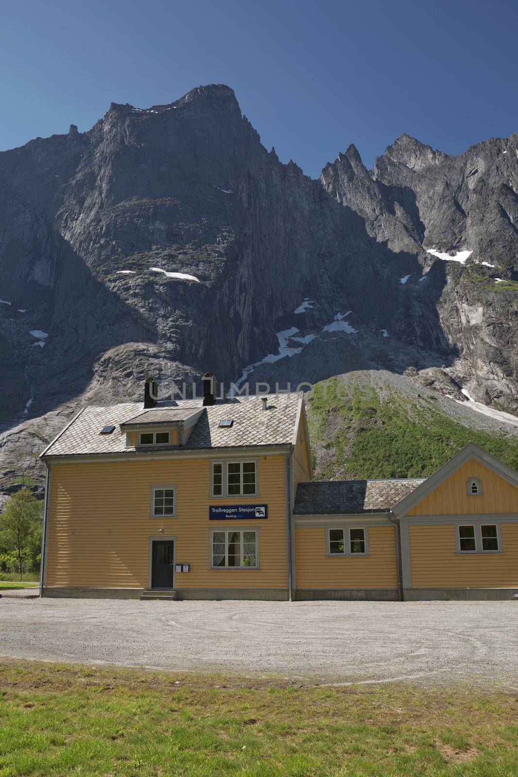 Rauma Railway Station, an historic wooden building, on the famous scenic railway, below the Troll Wall, a steep vertical rock face, Rauma Municipality, More Og Romsdal, Norway by wondry