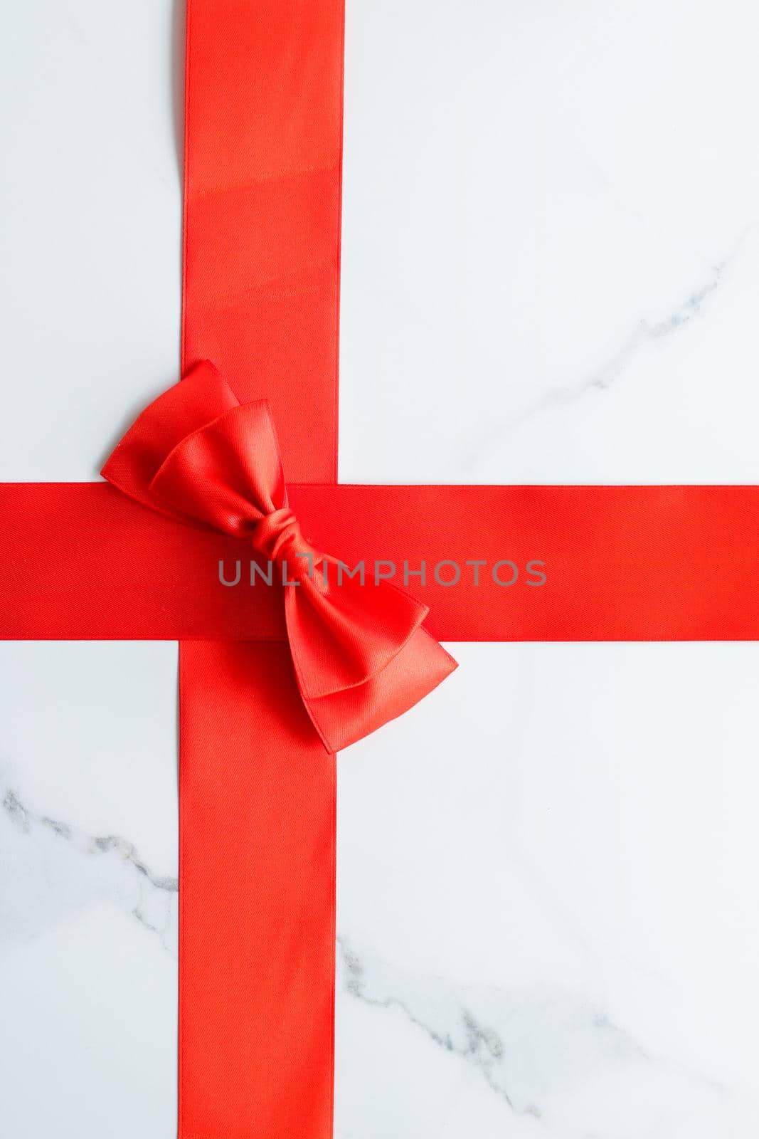 Holiday decor, feminine design and flatlay concept - Red silk ribbon on marble, top view