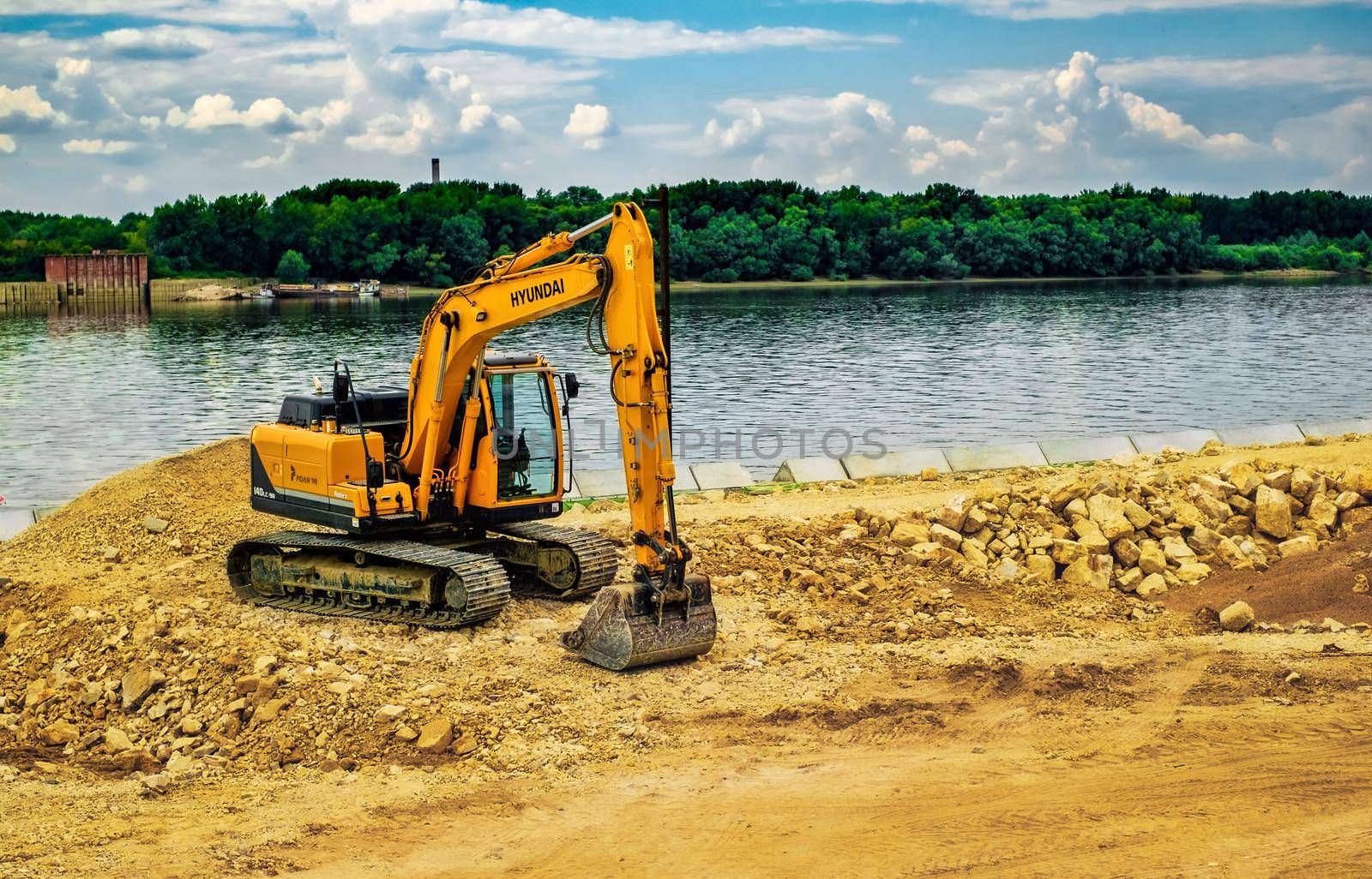 Ruse city, Bulgaria - September 18, 2017, The modern excavator performs excavation work on the construction site in Ruse city, Bulgaria.