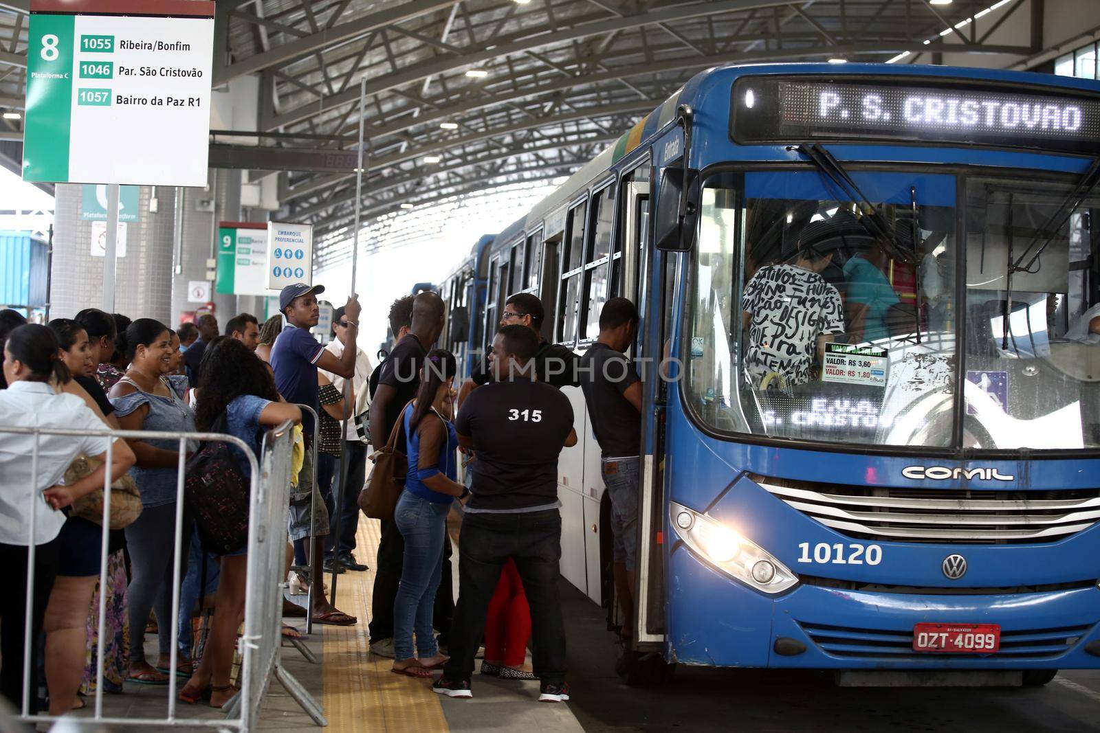 salvador, bahia / brazil - september 8, 2017: Passengers are seen during boarding buses at Estacao Mussurunga in the city of Salvador. The place serves as a transfer station in connection with line 2 of the city's metro.