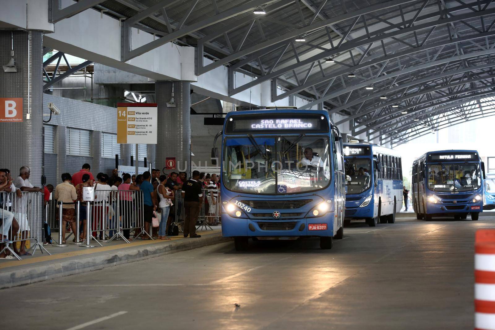 salvador, bahia / brazil - september 8, 2017: Passengers are seen during boarding buses at Estacao Mussurunga in the city of Salvador. The place serves as a transfer station in connection with line 2 of the city's metro.