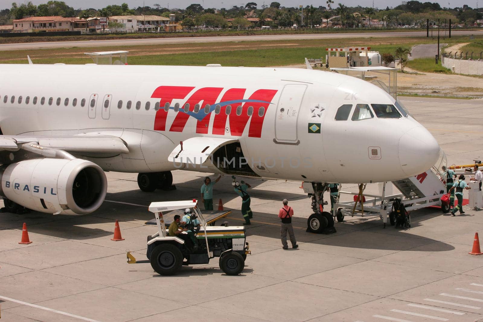 porto seguro, bahia / brazil - november 23, 2010: Airbus A320-232 aircraft from the airline Tam is seen on the patio of the airport in the city of Porto Seguro, in southern Bahia.

