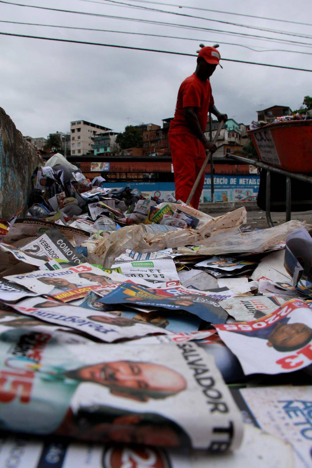 salvador, bahia / brazil - october 8, 2012: Gari is seen collecting electoral propaganda pamphlet paper during elections in the city of Salvador.
