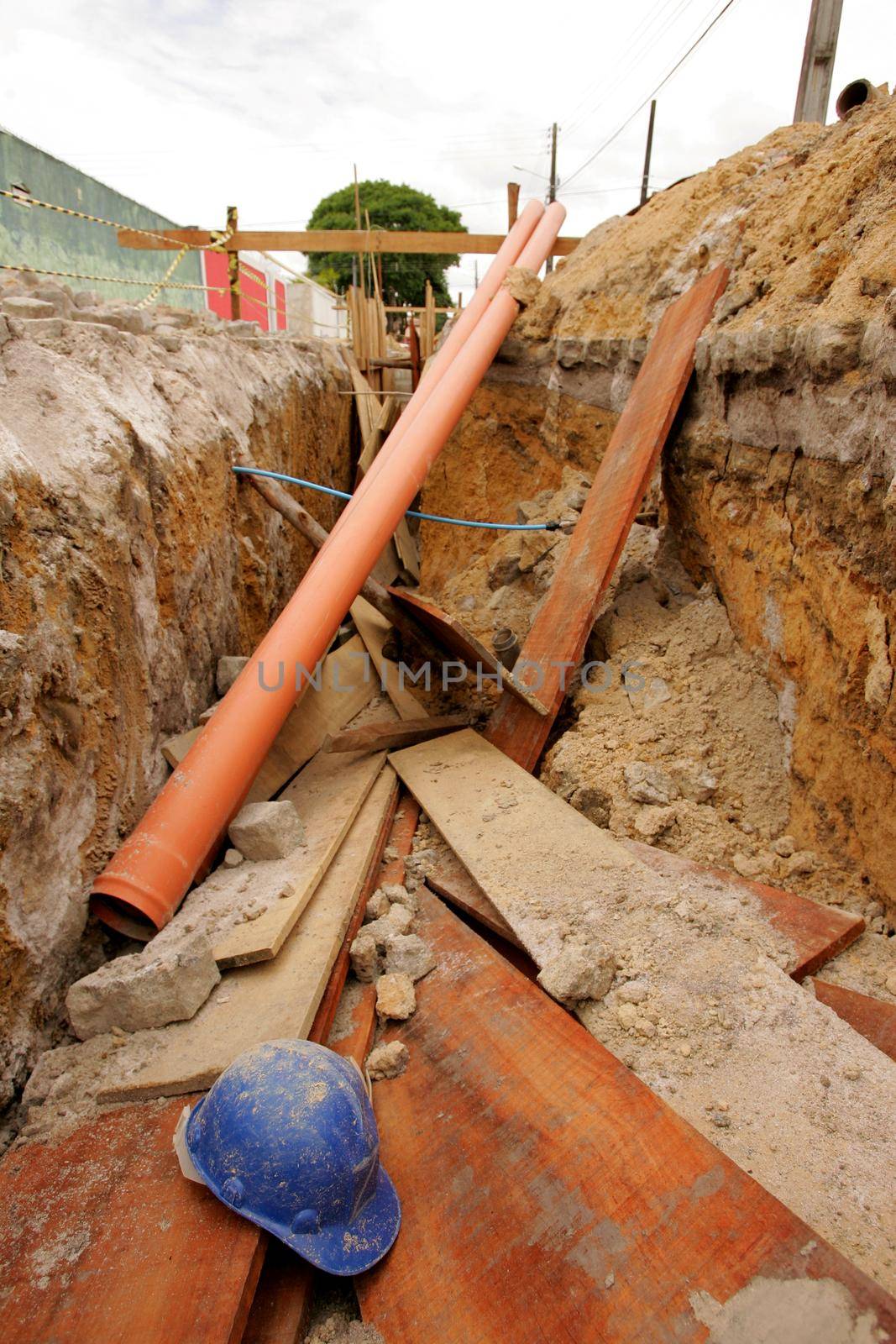 eunapolis, bahia / brazil - november 8, 2010: hole dug for the implementation of a sewage system in a street in the municipality of Eunapolis, southern Bahia.
