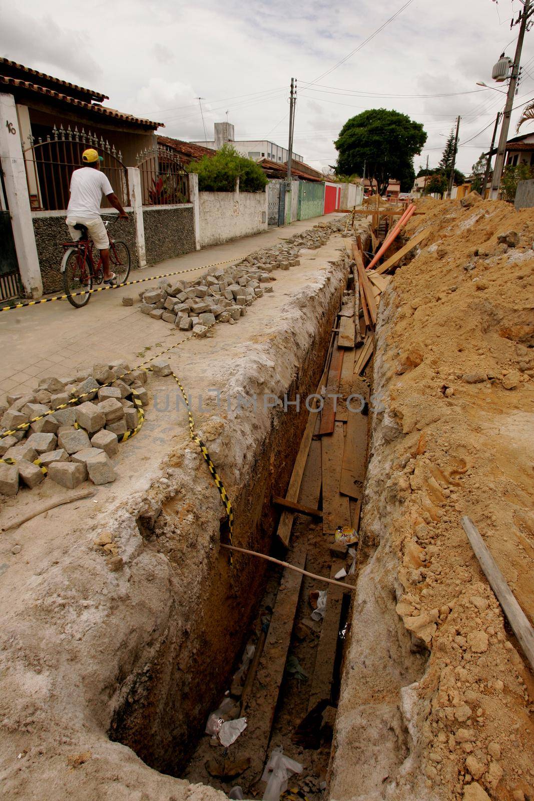 eunapolis, bahia / brazil - november 8, 2010: hole dug for the implementation of a sewage system in a street in the municipality of Eunapolis, southern Bahia.
