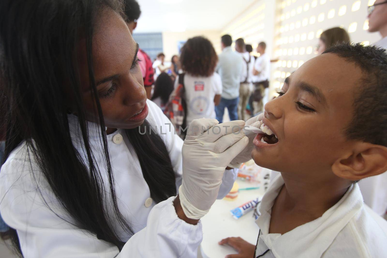 salvador, bahia / brazil - november 8, 2018:  Student of public school in the Bairro da Paz in Salvador learn to brush their teeth during social action. 