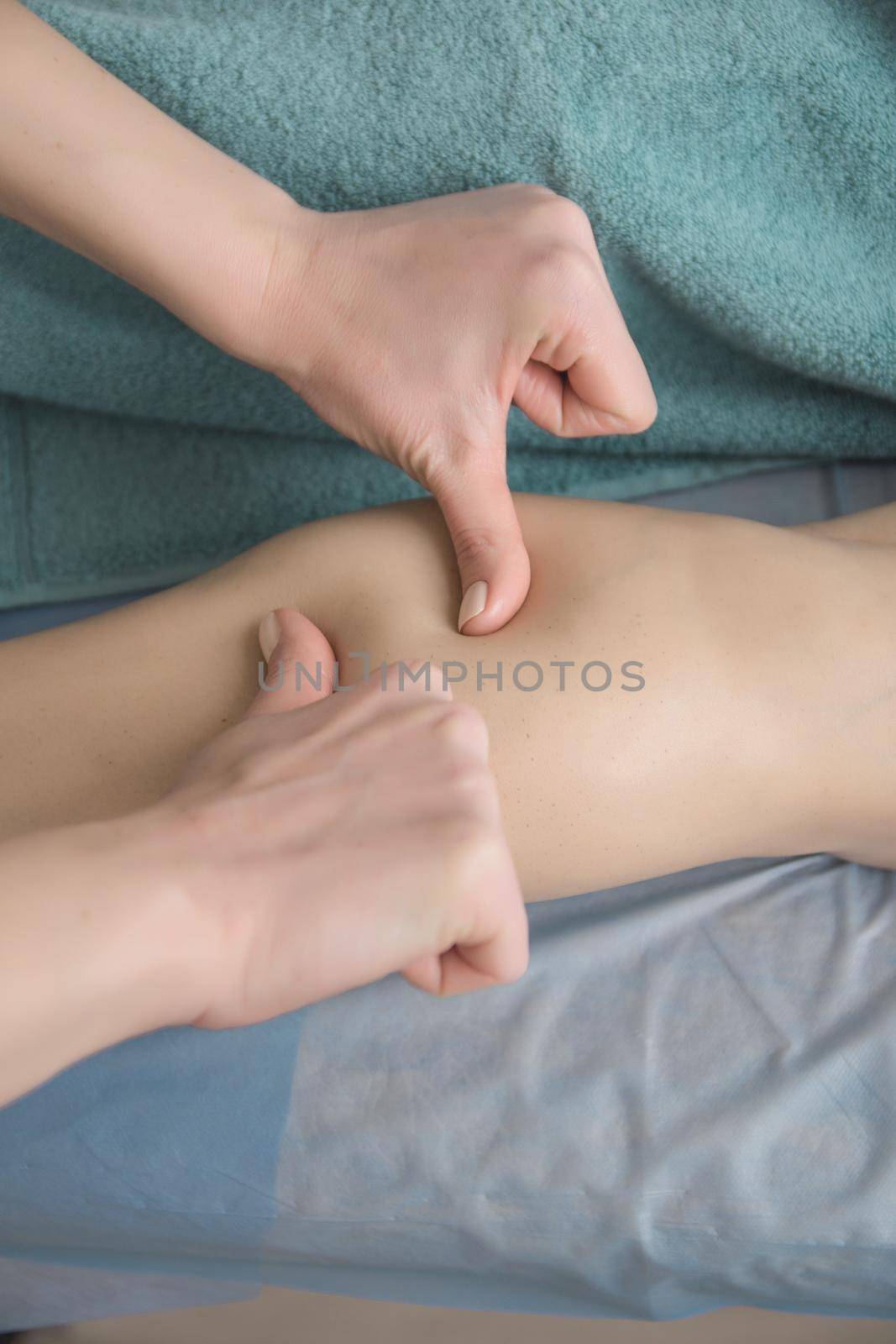 anti-cellulite foot massage in the spa salon makes the girl a cosmetology