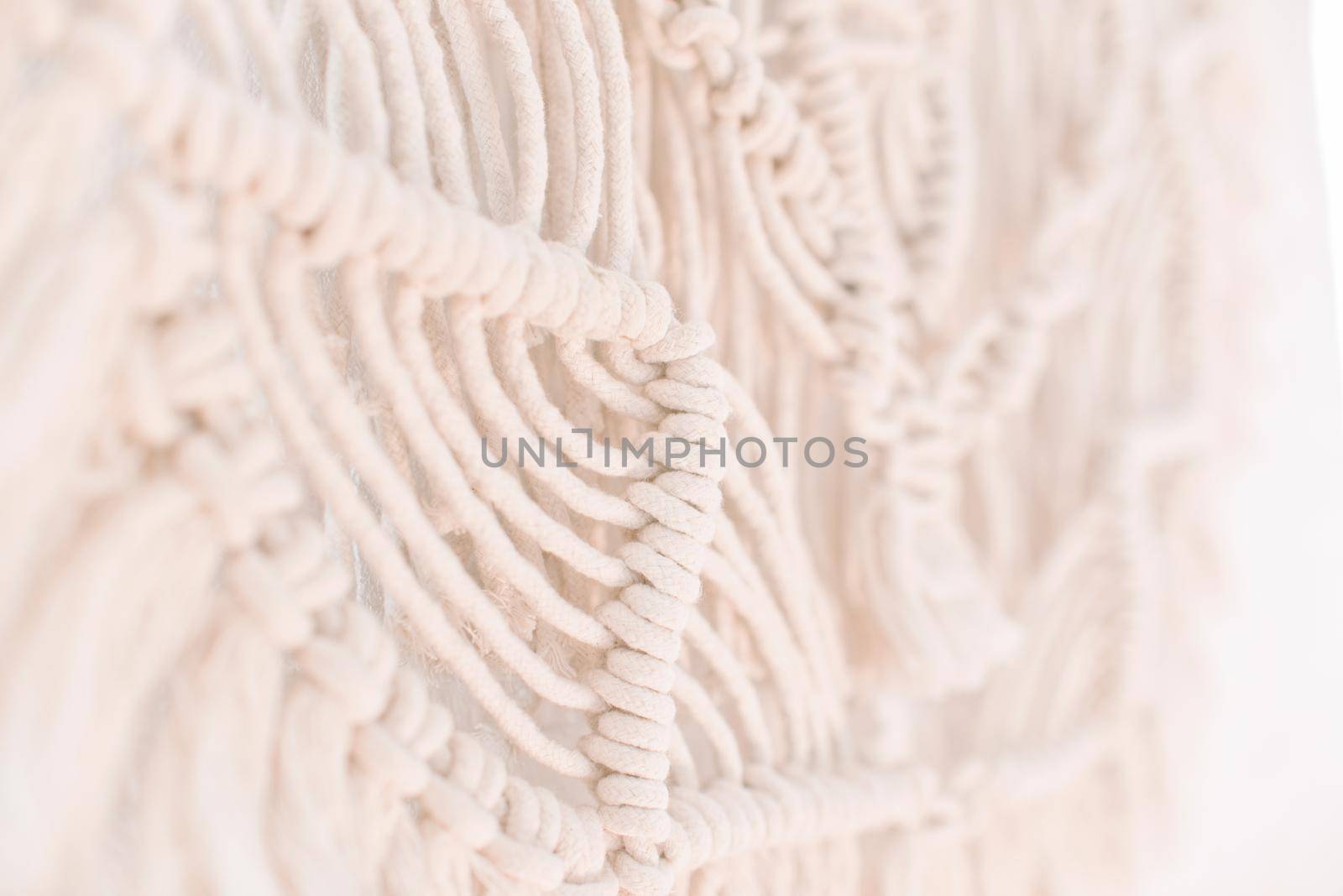 wall panel in boho style made of cotton threads of natural color by ozornina