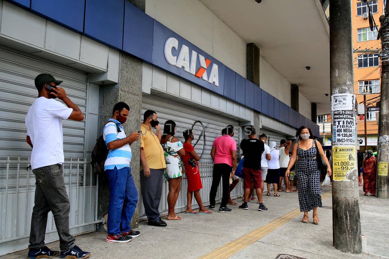 salvador, bahia, brazil - december 14, 2020: people are seen in line at Caixa Economica Federal, in downtown Salvador.