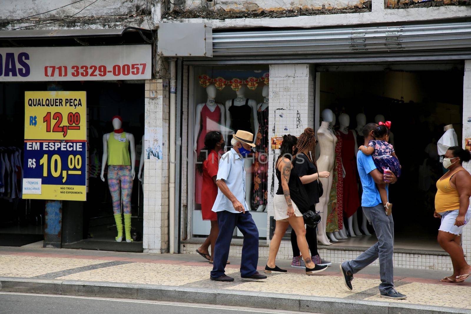 salvador, bahia, brazil - december 14, 2020: movement of people using a protective mask against the corona virus, in a street store in downtown Salvador.
