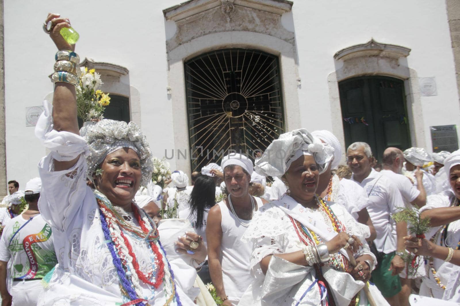 salvador, bahia / brazil - january 15, 2015: Baianas wash the stairs of the Church of Bonfim, during traditional party for Catholics and Candomble fan.