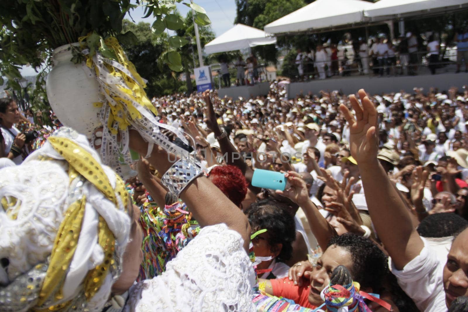 salvador, bahia / brazil - january 15, 2015: Candomble fans and devotees of Senhor do Bonfim accompany the traditional washing of the stairs of the Bonfim Church in Salvador.