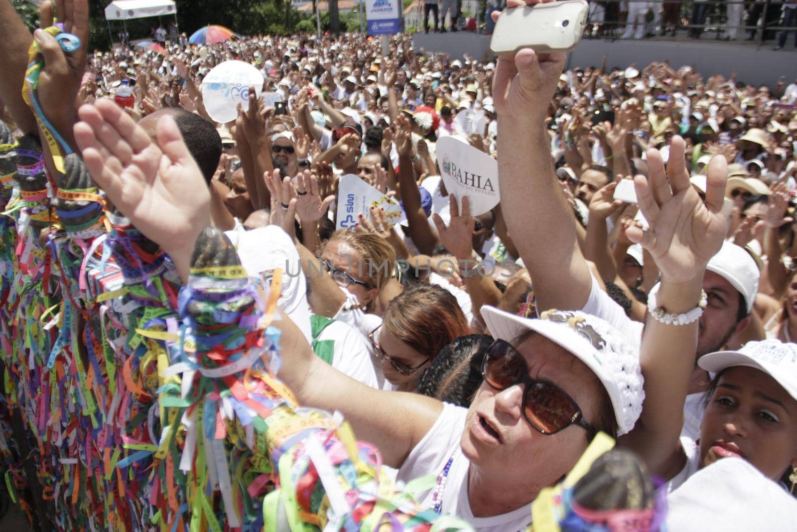 salvador, bahia / brazil - january 15, 2015: Candomble fans and devotees of Senhor do Bonfim accompany the traditional washing of the stairs of the Bonfim Church in Salvador.