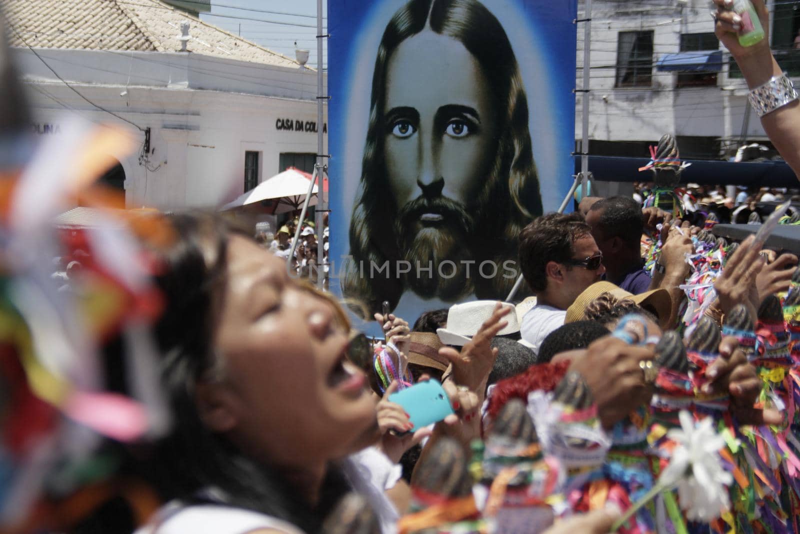 salvador, bahia / brazil - january 15, 2015: Candomble fans and devotees of Senhor do Bonfim accompany the traditional washing of the stairs of the Bonfim Church in Salvador.