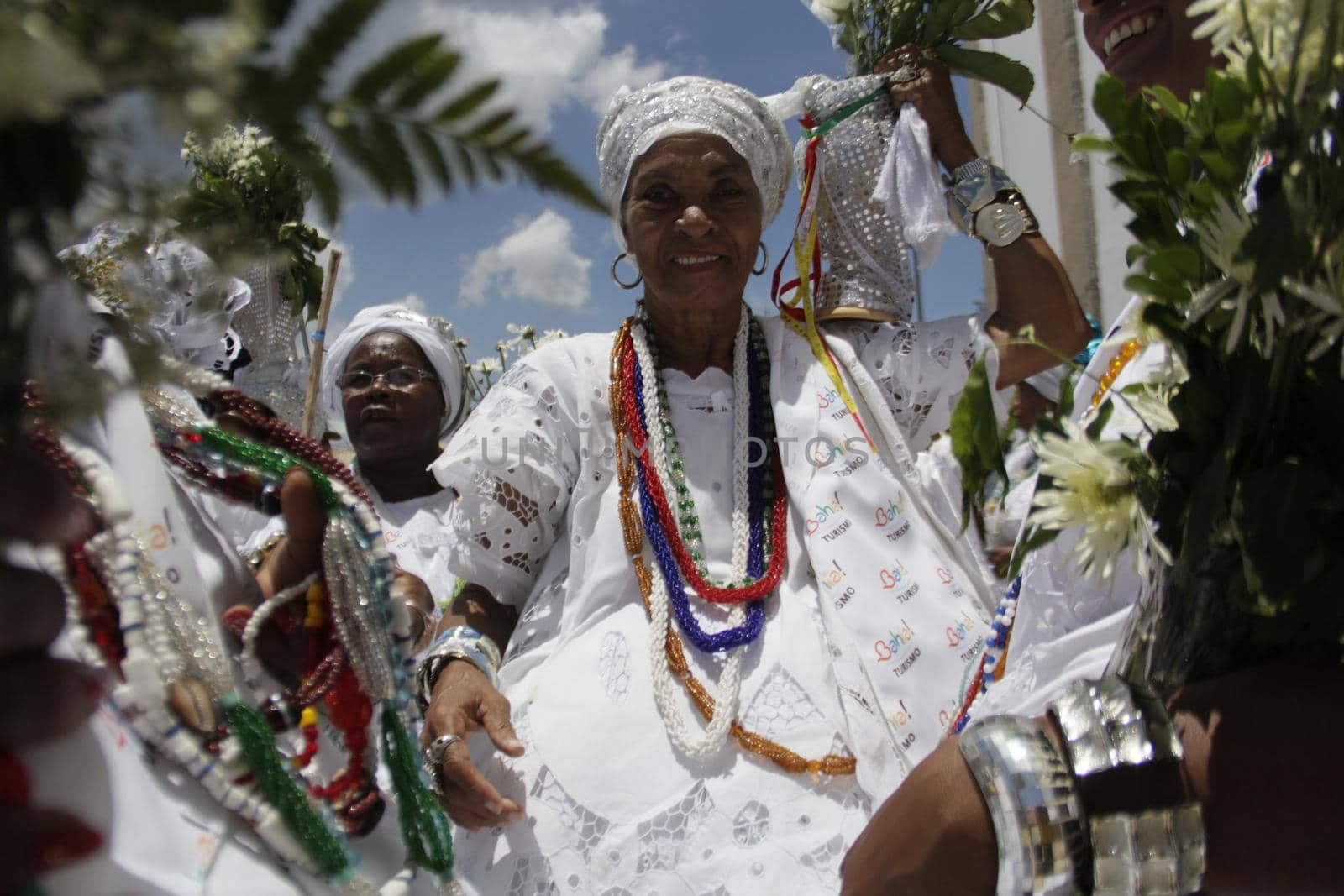salvador, bahia / brazil - january 15, 2015: Baianas wash the stairs of the Church of Bonfim, during traditional party for Catholics and Candomble fan.