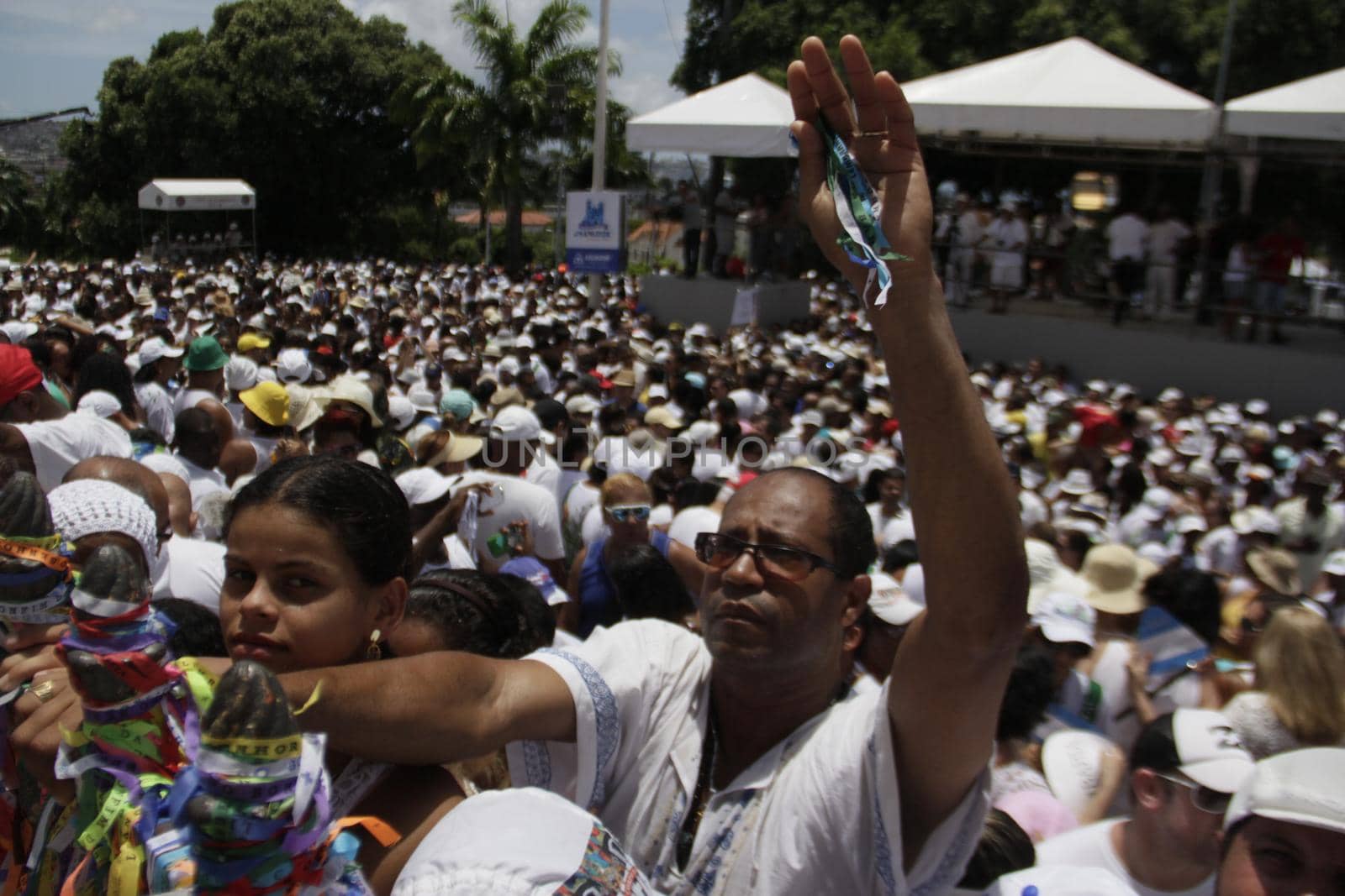 salvador, bahia / brazil - january 15, 2015: Candomble fans and devotees of Senhor do Bonfim accompany the traditional washing of the stairs of the Bonfim Church in Salvador.