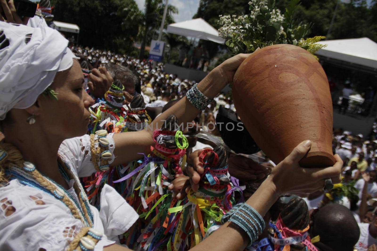 salvador, bahia / brazil - january 15, 2015: Baianas wash the stairs of the Church of Bonfim, during traditional party for Catholics and Candomble fan.