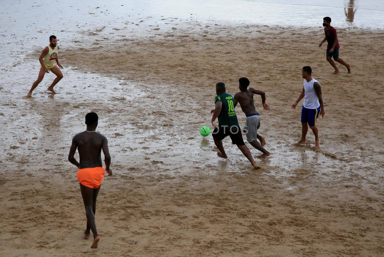 salvador, bahia, brazil - january 15, 2021: people are seen playing football on Ondina beach in the city of Salvador.
