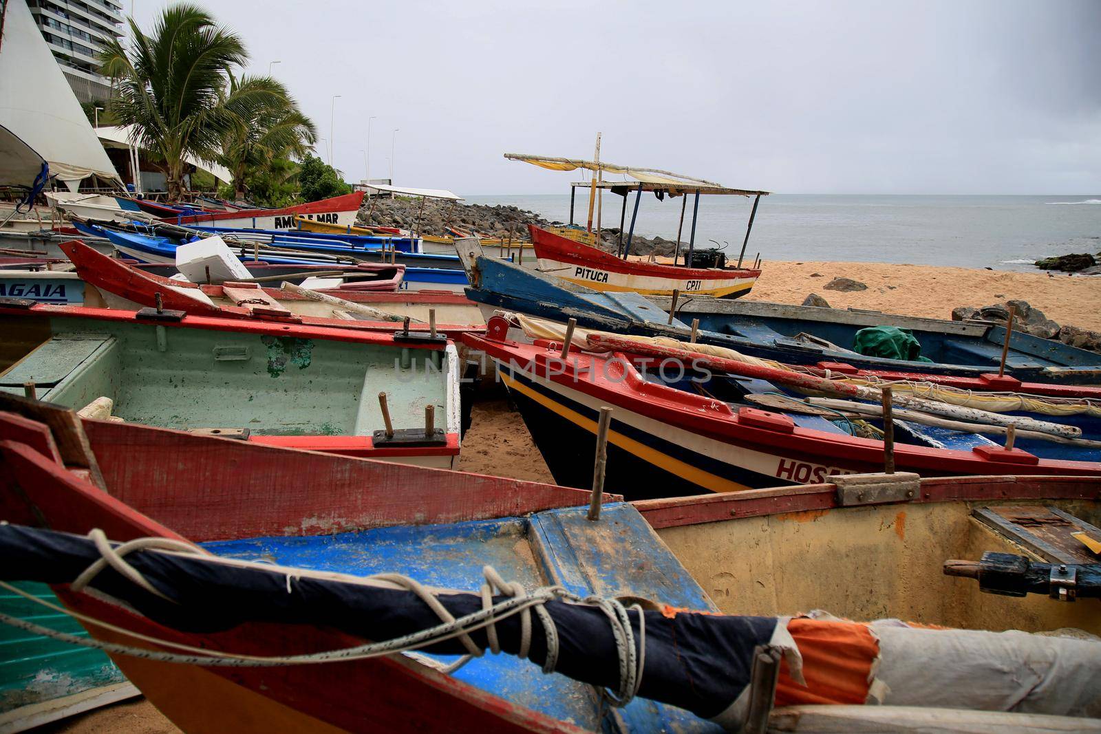 salvador, bahia, brazil - january 15, 2021: fishing boats are seen collected in the sand of Paciencia beach, in the Rio Vermelho neighborhood, in the city of Salvador, due to rainy weather.