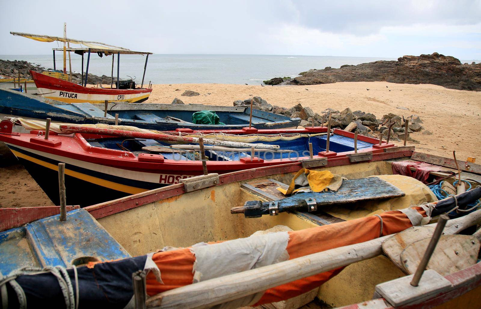 salvador, bahia, brazil - january 15, 2021: fishing boats are seen collected in the sand of Paciencia beach, in the Rio Vermelho neighborhood, in the city of Salvador, due to rainy weather.