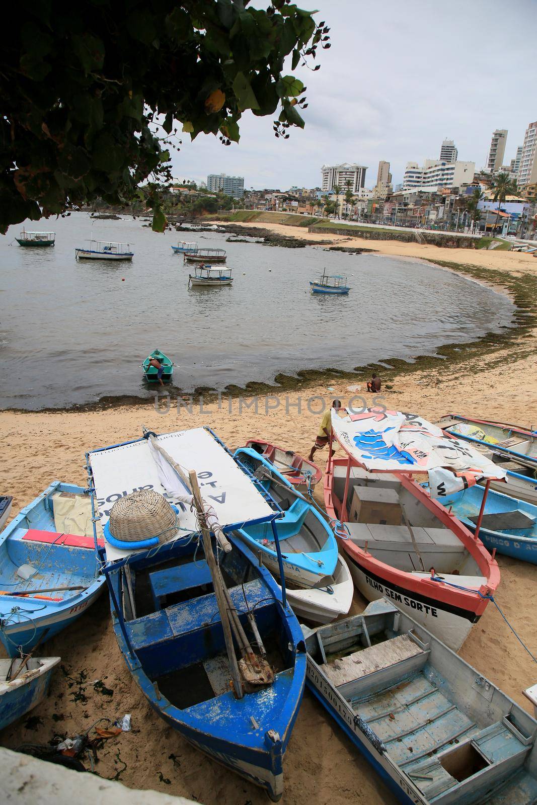 salvador, bahia, brazil - january 15, 2021: fishing boats are seen collected in the sand of Paciencia beach, in the Rio Vermelho neighborhood, in the city of Salvador, due to rainy weather.