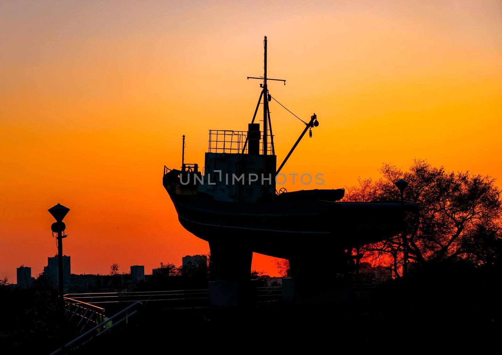 Vladivostok, Russia-September 29, 2019: Silhouette of the monument to the sailors on the background of the sunset.
