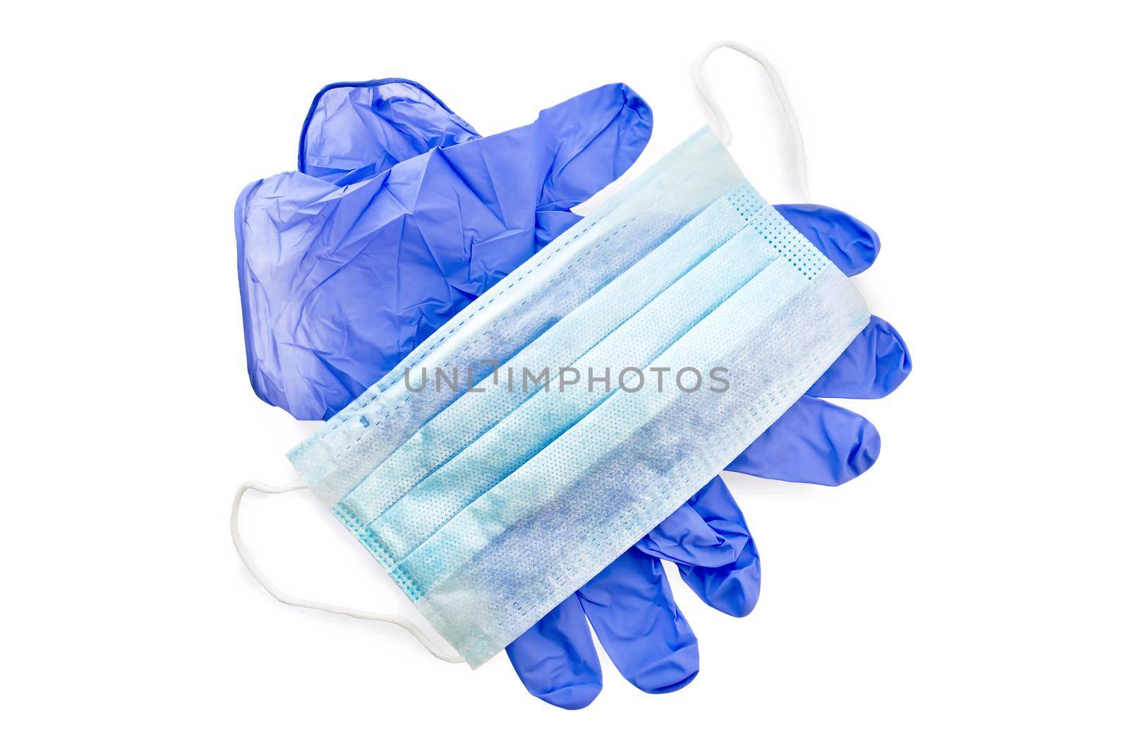 Blue latex gloves and medical disposable mask isolated on white background
