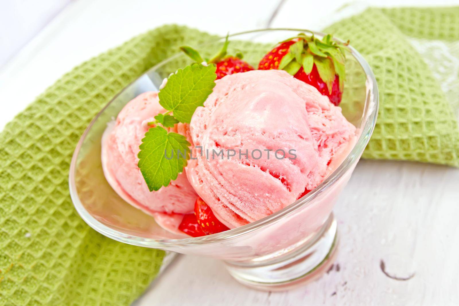Ice cream strawberry in glass on board by rezkrr