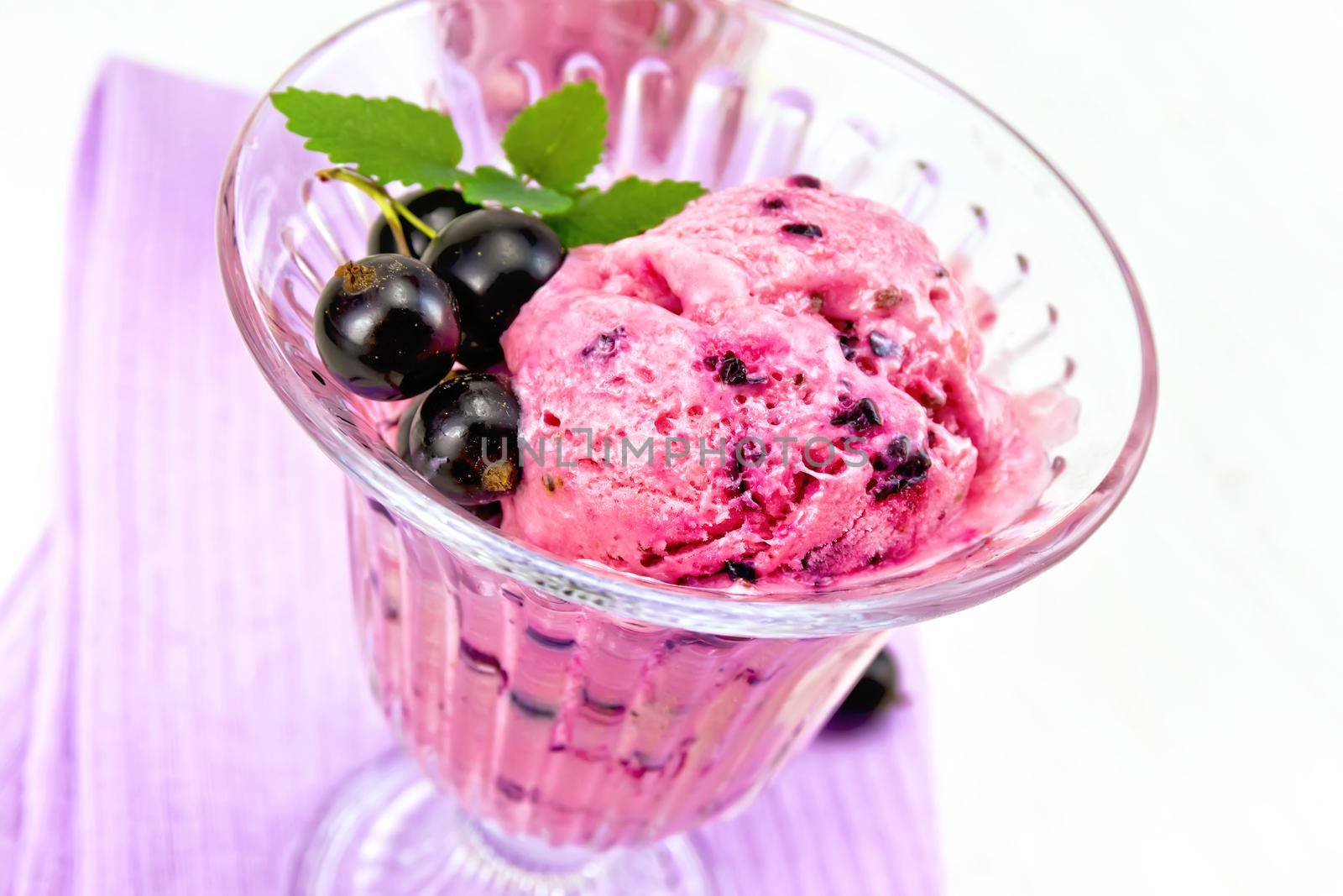 Ice cream with black currant on board by rezkrr