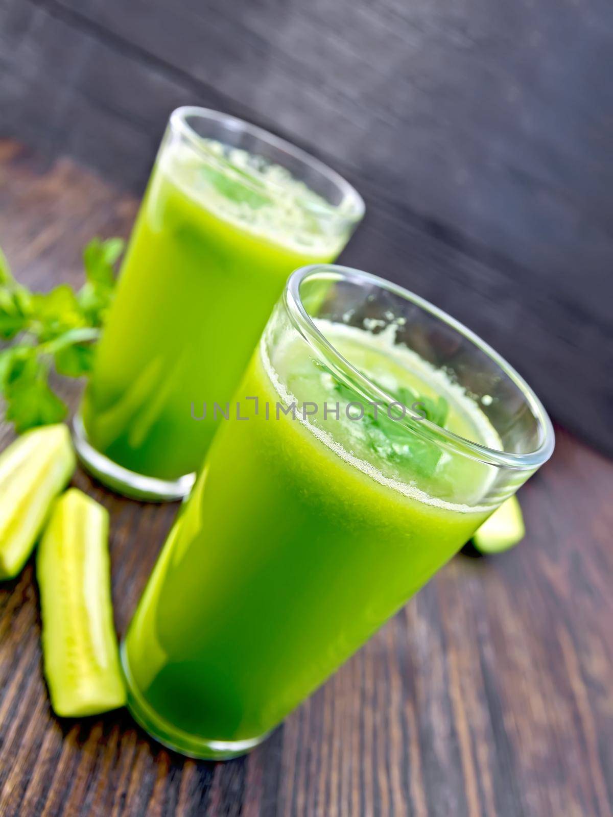 Juice cucumber in two glass on board by rezkrr