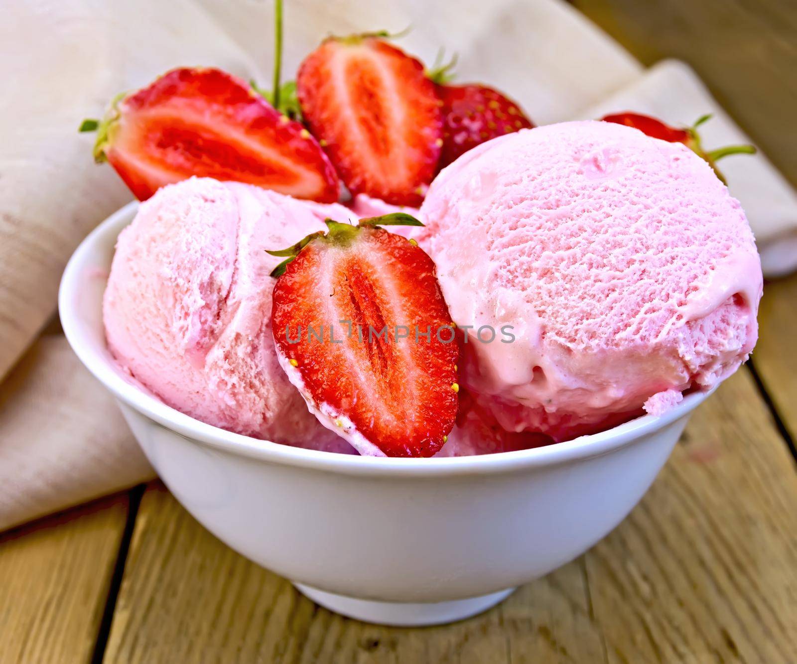 Ice cream strawberry in bowl on board with cloth by rezkrr