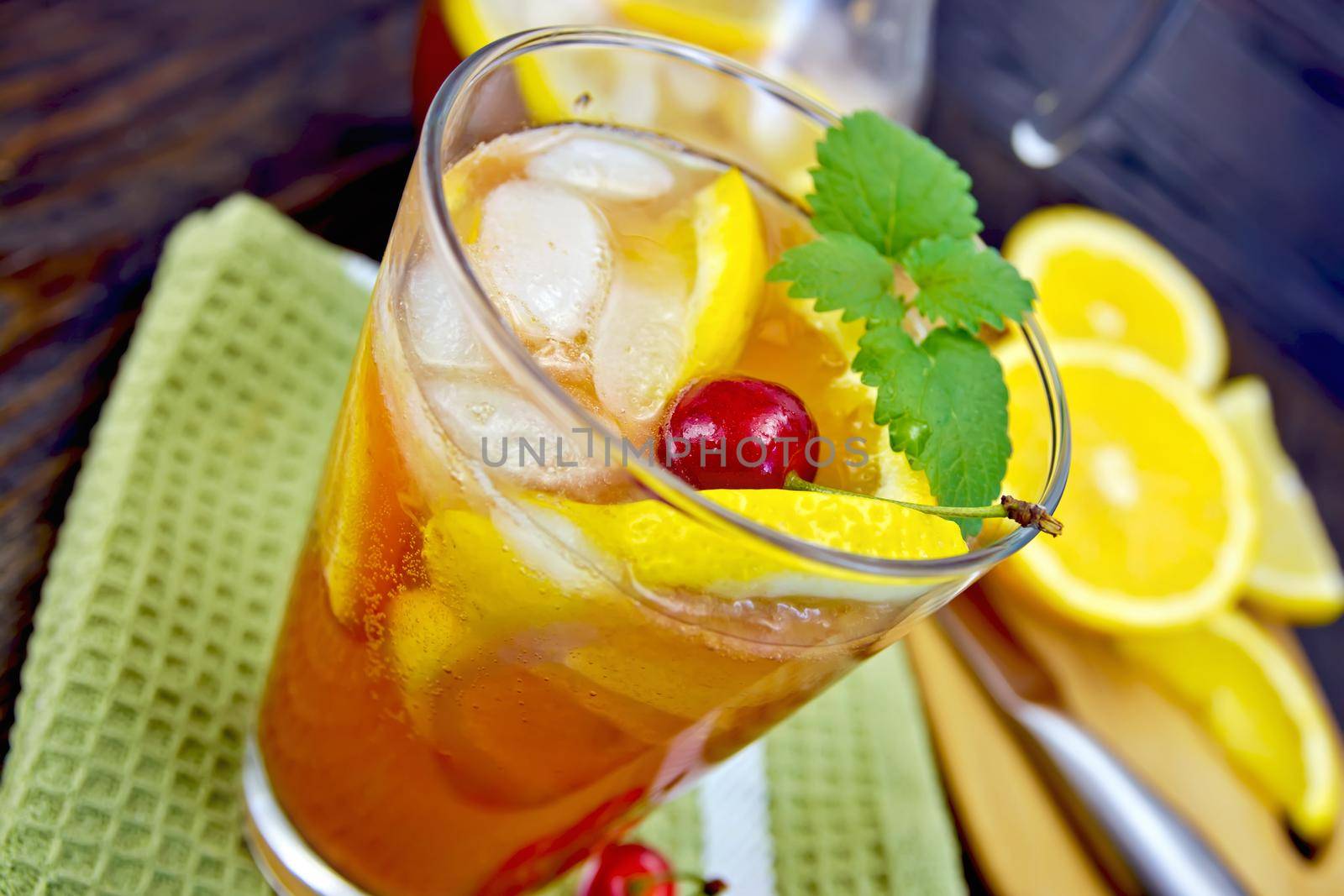 Lemonade with cherry in glassful on board by rezkrr