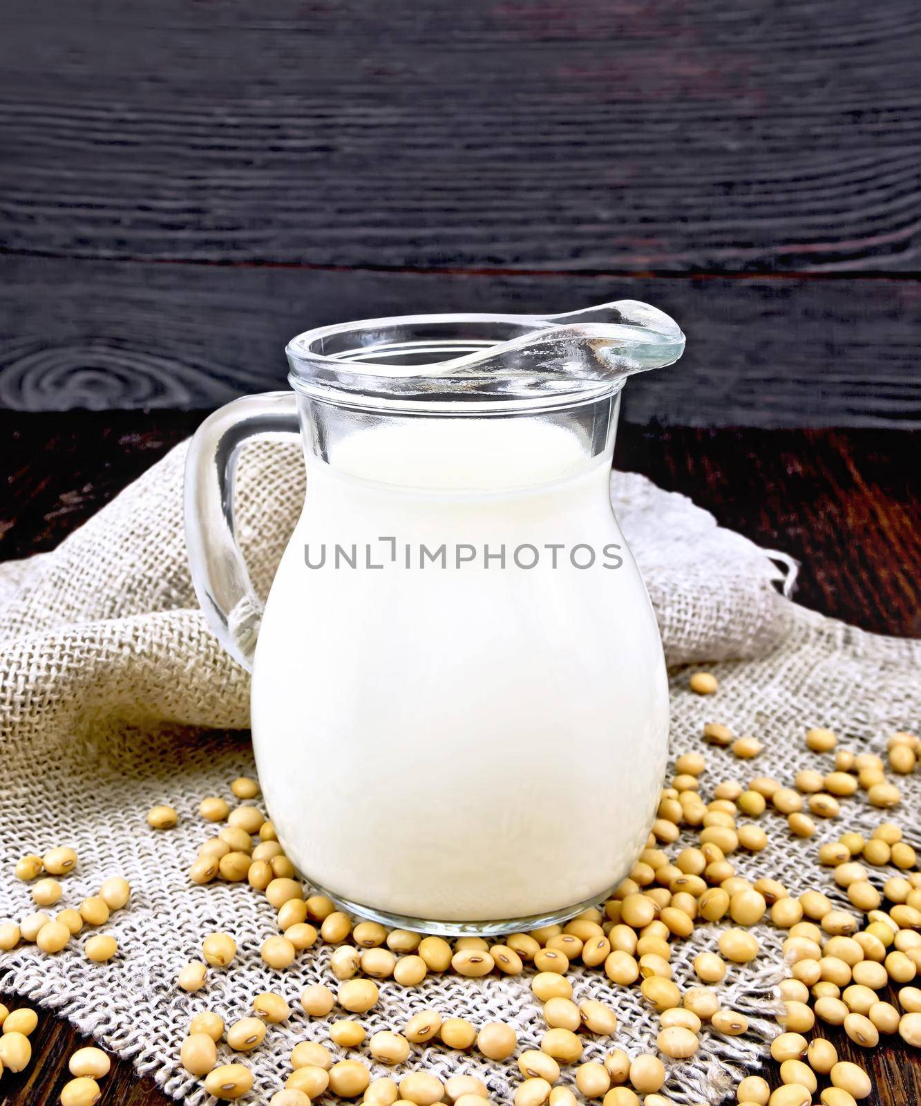 Milk soy in jug on dark board by rezkrr