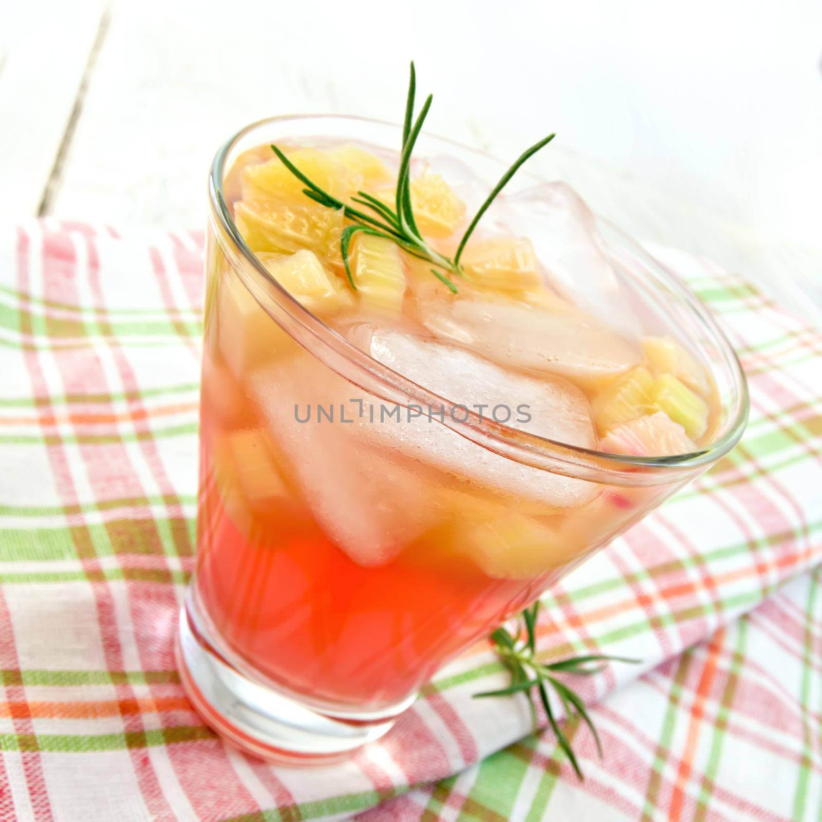Lemonade with rhubarb and rosemary on pink napkin by rezkrr