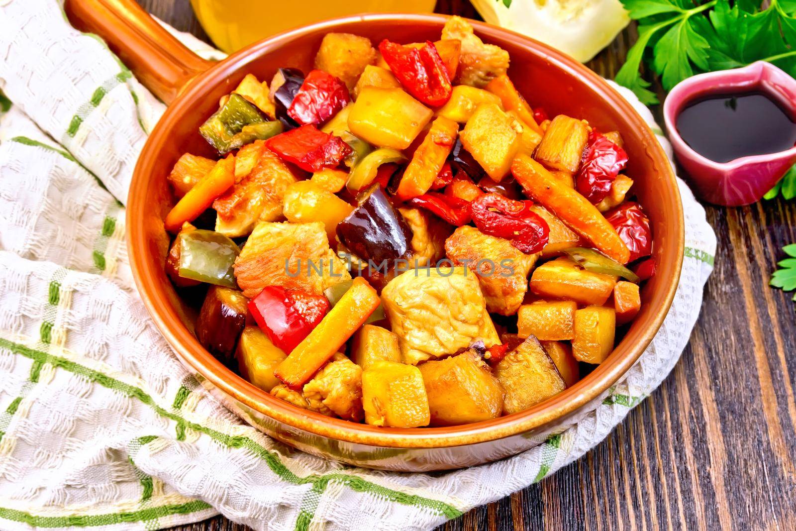 Roast with vegetables and honey in pan on napkin by rezkrr
