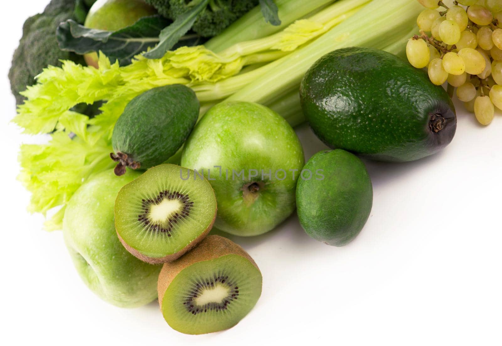 fresh vegetables with leaves - kiwi, grapes, apples and crashes, cucumbers, zucchini, broccoli, cabbage and greens isolated on white background. by aprilphoto