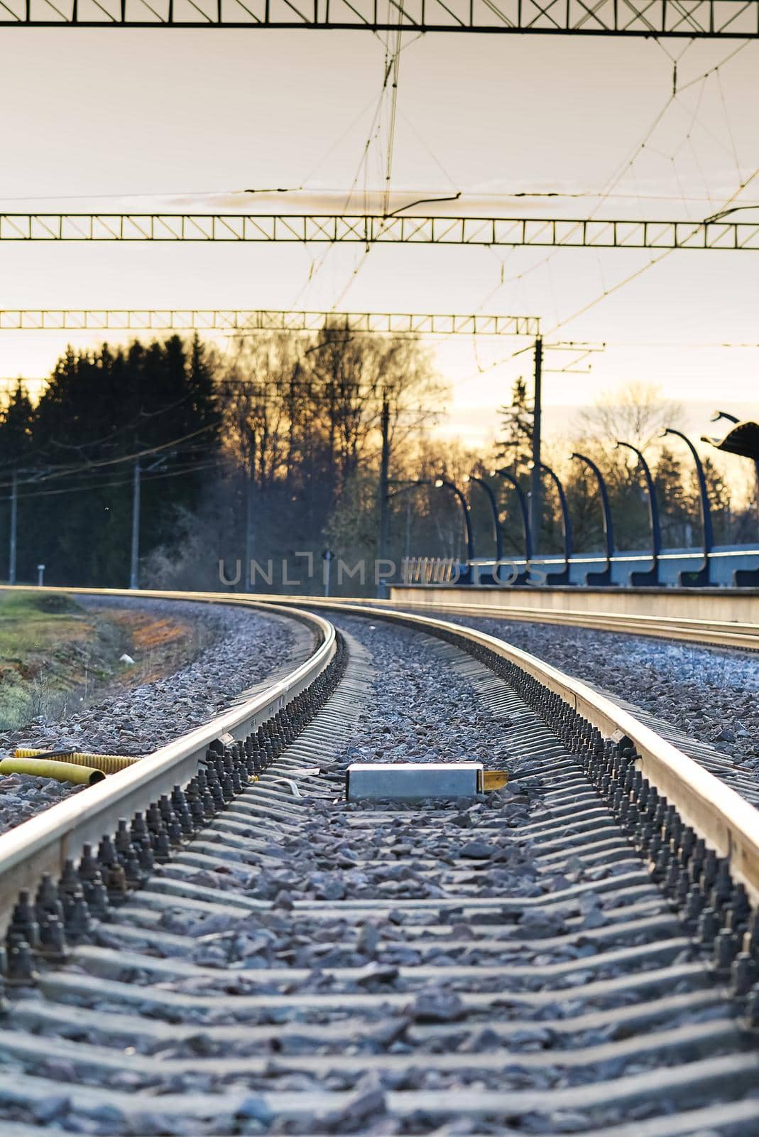 railroad rails on concrete sleepers. updated railway for high-speed, express train railway by PhotoTime