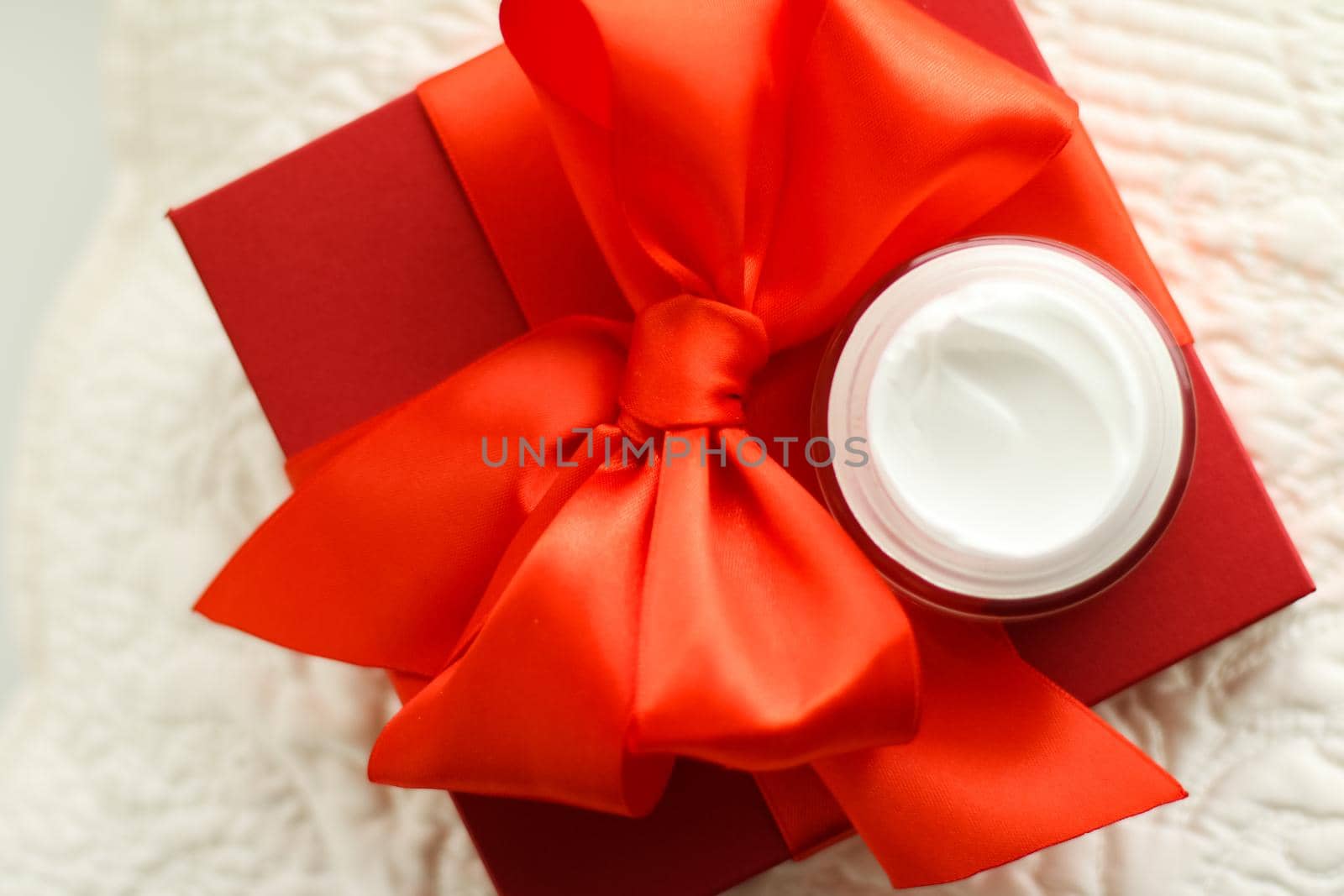 Beauty, cosmetics and skincare styled concept - Luxury face cream jar and red gift box