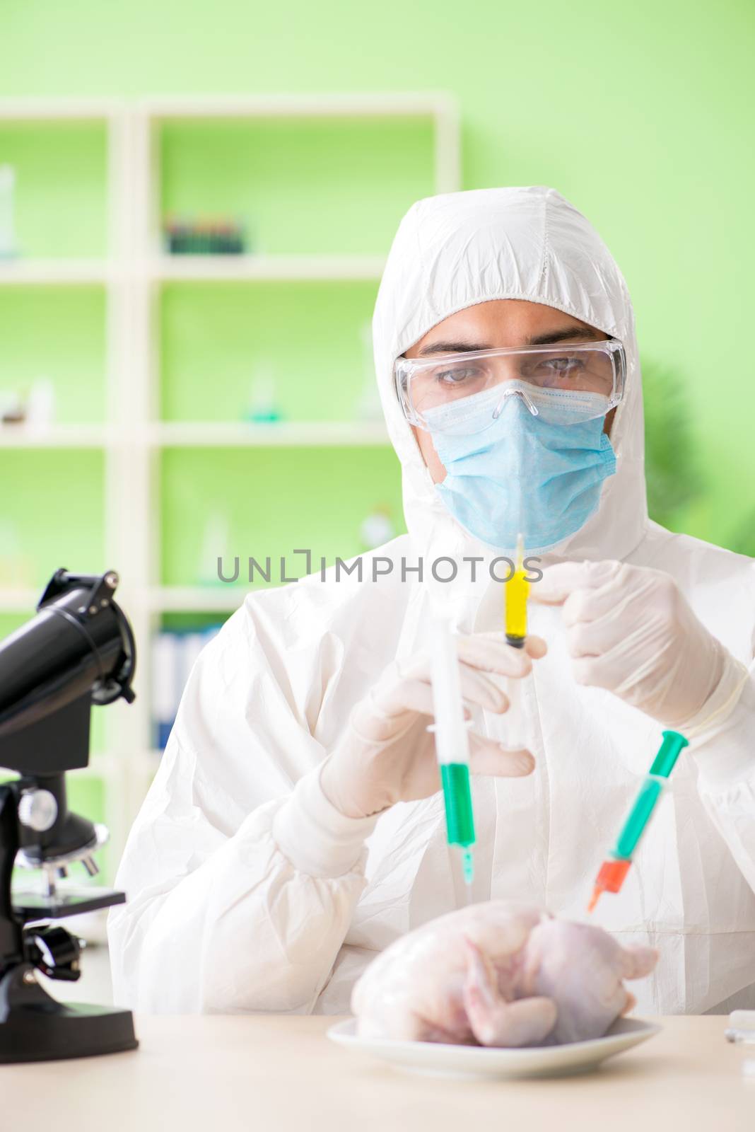 Lab assistant testing GMO chicken