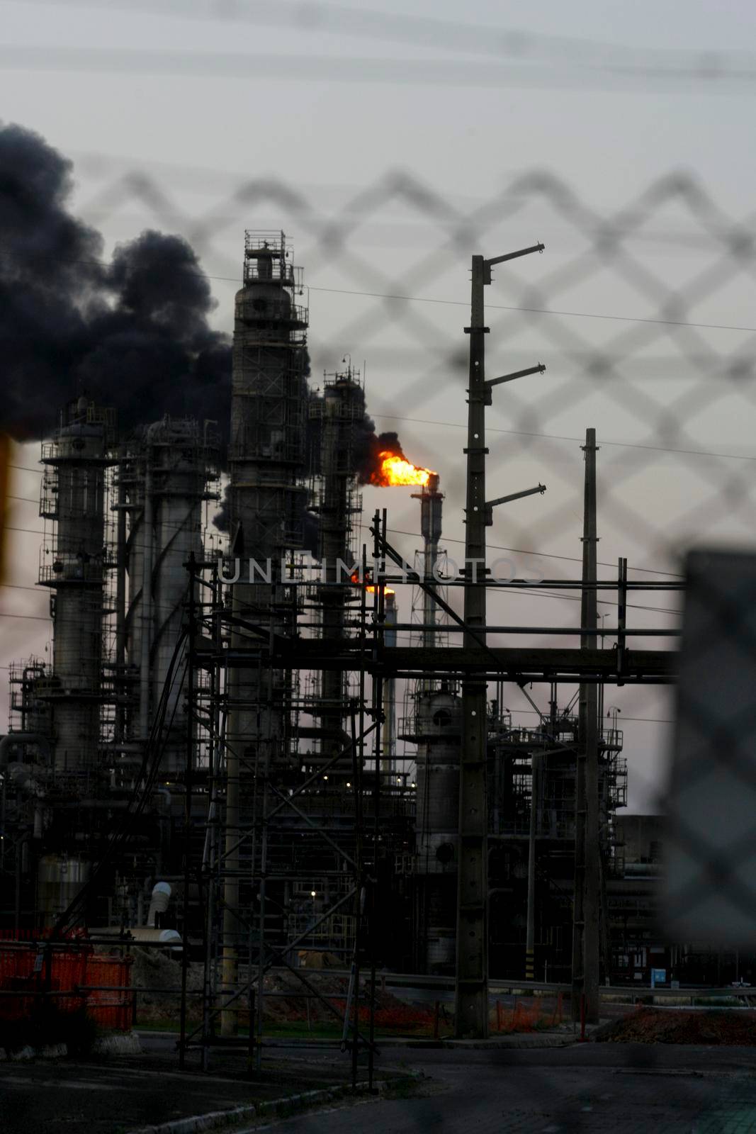 camacari, bahia / brazil - august 28, 2013: Polluting gases are seen coming out of chimney in factory of the Industrial Pole of Camacari.