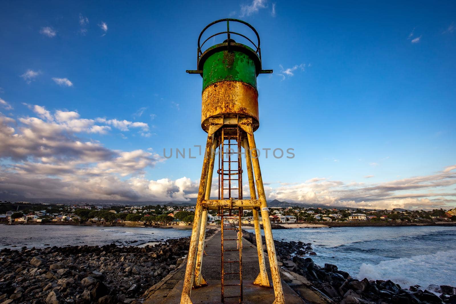 Jetty and lighthouse in Saint-Pierre, La Reunion island by photogolfer