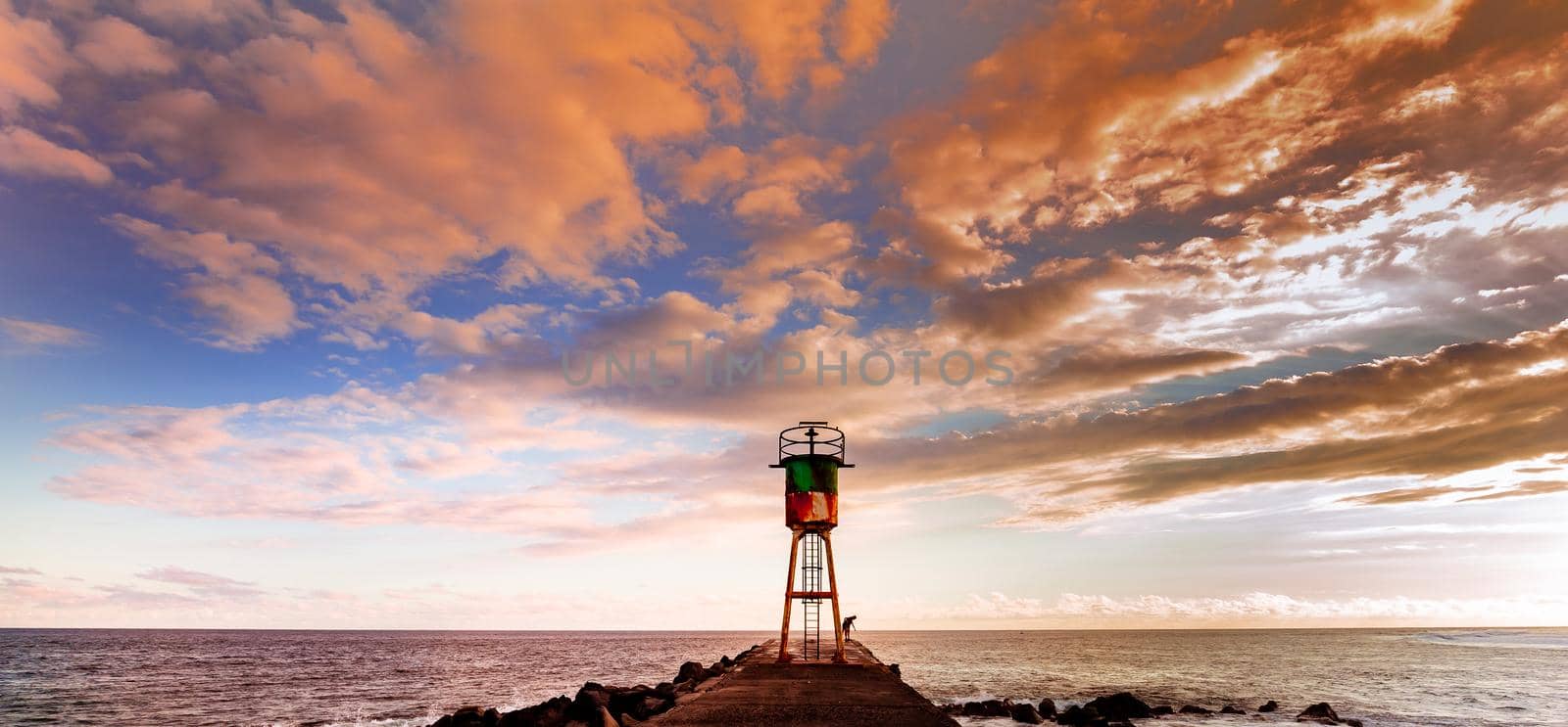 Jetty and lighthouse in Saint-Pierre, La Reunion island by photogolfer