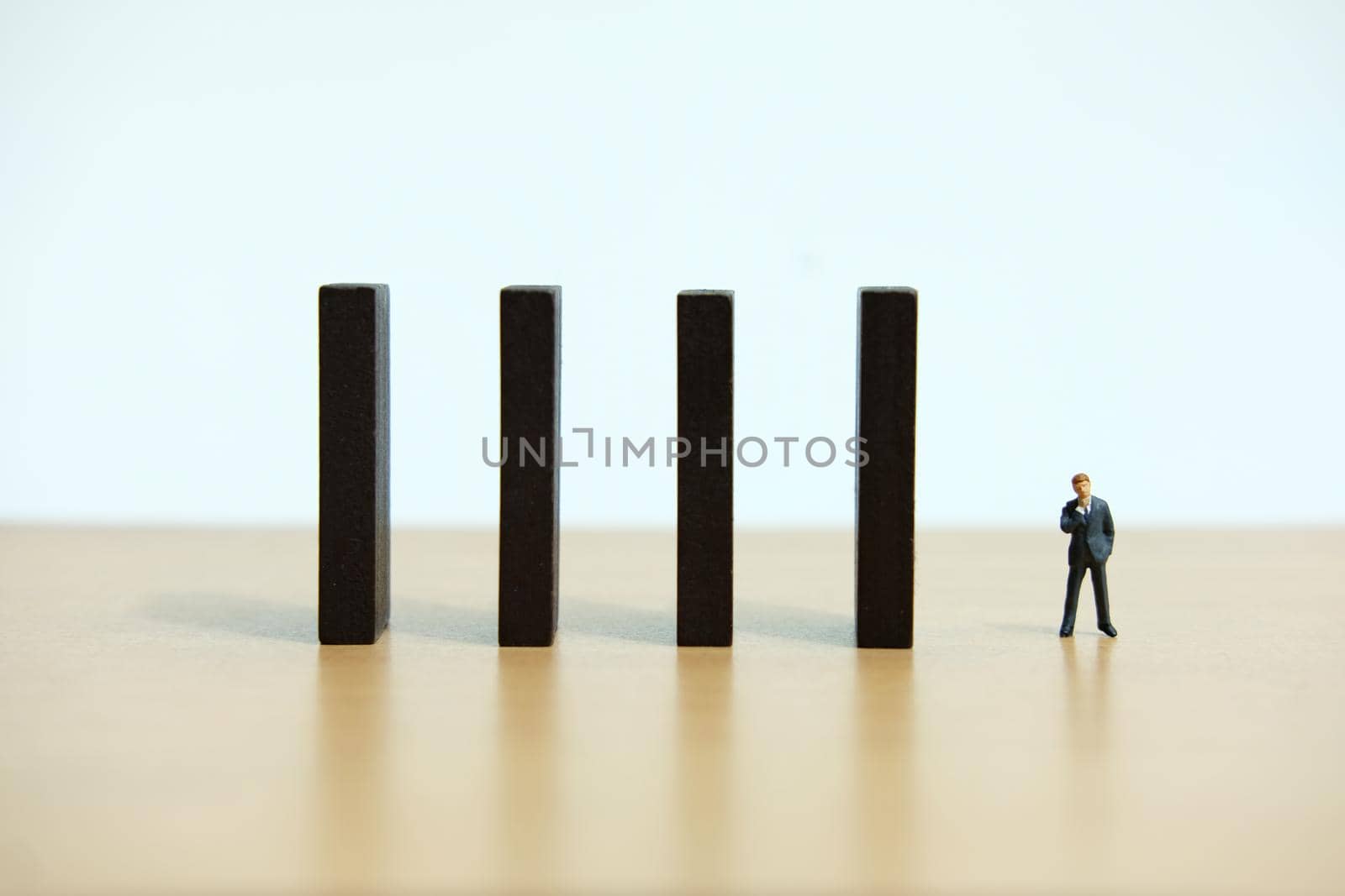 Business strategy conceptual photo - Miniature of businessman stands at the edge of wooden bridge staircase. Image photo