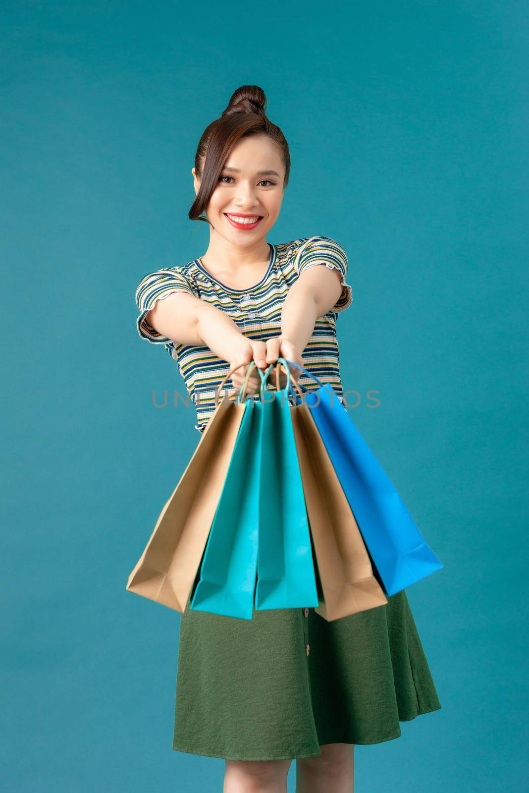 Woman with colored shopping bag
