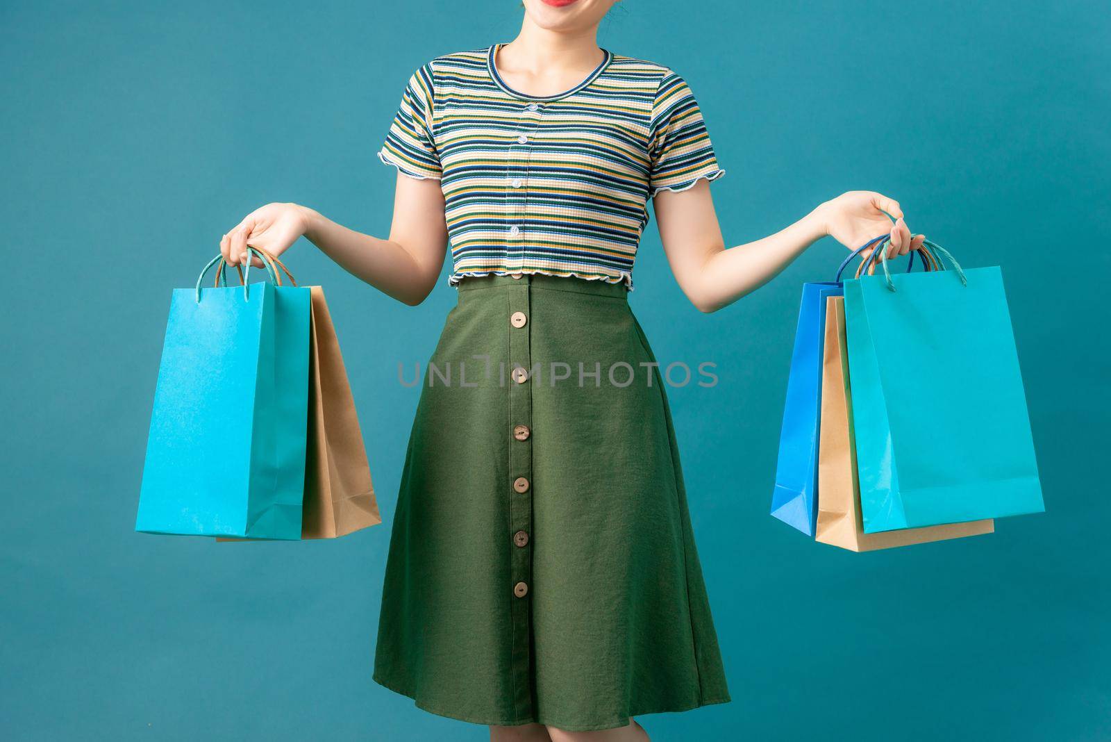 Woman with colored shopping bag